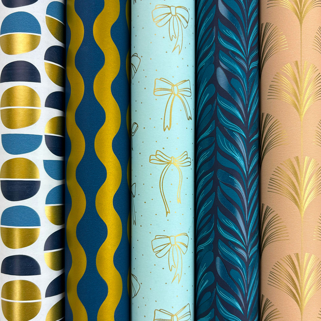 wrapping paper, patterned paper, colorful rolls, gold accents, gift wrap