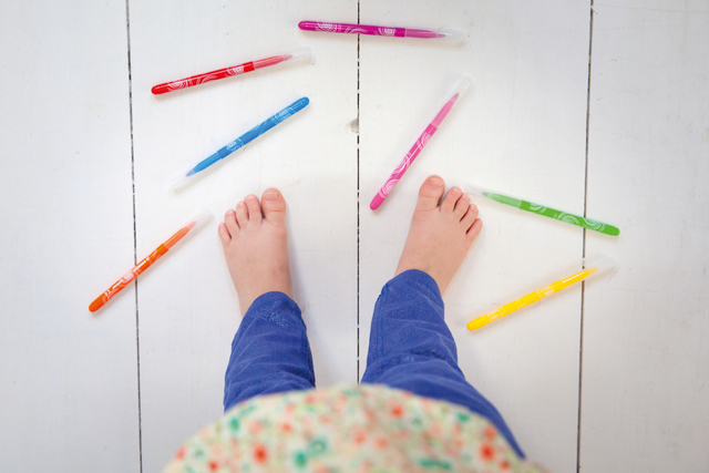 loopers, markers, crayons, child feet, colorful markers