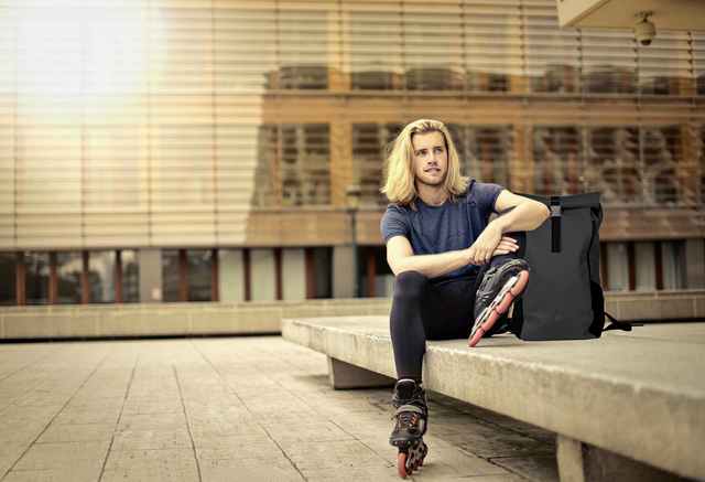 inline skates, roller skates, backpack, urban, outdoor scene
