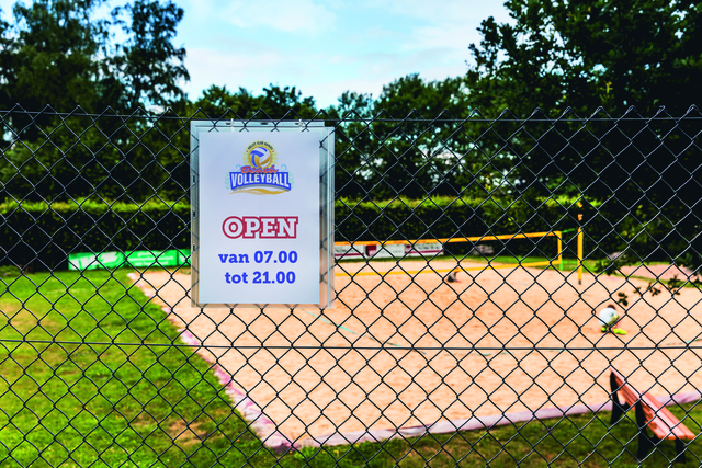 volleyball court, net, outdoor, fence, sign