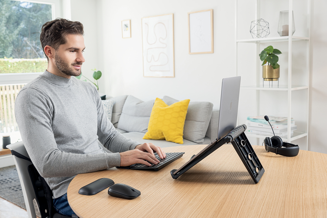 laptop, desk setup, stand, external monitor, headphones